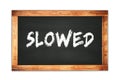 SLOWED text written on wooden frame school blackboard