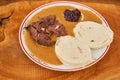 Slowly roasted beef sirloin in creamy sweet and sour sauce with czech bread dumplings and slice of lemon with cranberry jam on top