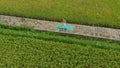 Slowmotion aerial shot of a young woman doing meditation for Muladhara chakra in a Balinese way