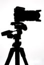 SLR camera on tripod isolated on white Royalty Free Stock Photo