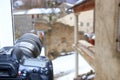 SLR camera on a tripod taking pictures of french village Royalty Free Stock Photo