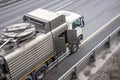 Sludge washer truck at work on the side of the highway to clean underground infrastructure, eliminate blockages in the sewer road Royalty Free Stock Photo