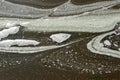 SLUDGY FOAM PATTERNS AND CONTOURS IN THE THICK SLUDGE ON THE EDGE OF A MINERAL LAKE ON THE BOTTOM OF A METEORITE CRATER