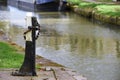 Sluice gate control for flood prevention on canal tow path Royalty Free Stock Photo
