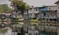 In slum area, the houses are old along the Khlong Phra Khanong Royalty Free Stock Photo