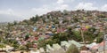 Slum district of Caracas with small wooden coloured houses