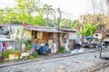 Slum houses near railway in a rural of Thailand.