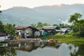 Slum houses on the river in Thailand Royalty Free Stock Photo