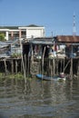 Slum houses on tilts on the Mekong River in Vietnam