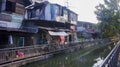 Slums house poor ramshakle of Southeast Asia along the Klong River. Thailand, Bangkok photo.