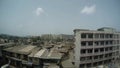slums and poor districts of Mumbai far some hills top view from metro bridge