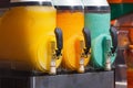 Slush machines with 3 colorful flavored frozen drinks ready to be served Royalty Free Stock Photo