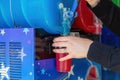 a slushie drink or slush puppy iced drink being poured from a machine into a plastic cup