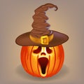 Sly pumpkin in a witch hat for Halloween