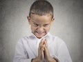 Sly scheming child boy plotting something bad Royalty Free Stock Photo