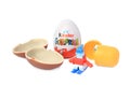 Slynchev Bryag, Bulgaria - May 23, 2023: Kinder Surprise Eggs, plastic capsule and toy on white background