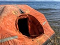 A smal life raft floating on the sea Royalty Free Stock Photo