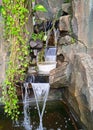 Smal waterfall in the fish pond Royalty Free Stock Photo