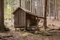 The small abandoned wooden house, located on the edge of a forest. The house is damaged. Czech Republic Royalty Free Stock Photo