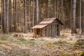 The small abandoned wooden house, located on the edge of a forest. The house is damaged. Czech Republic Royalty Free Stock Photo