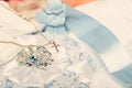 Small additions for baby baptism, clothes and shoes for the baby Royalty Free Stock Photo