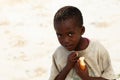 Small African boy with piece of bread