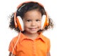 Small afro american girl with bright orange headphones Royalty Free Stock Photo