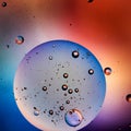 Small air bubbles in a big oil sphere, blue and red colors Royalty Free Stock Photo