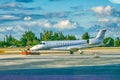 A small aircraft along the airport runway ready to takeoff Royalty Free Stock Photo