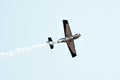 Small aircraft flying on a lite blue sky