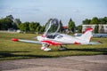 Small aircraft with propeller in parking lot