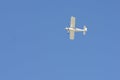 Small airplane in the blue sky Royalty Free Stock Photo