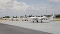 Small airplane in front of hangars Royalty Free Stock Photo