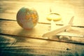 Small airplane and Globe and Magnify Glasses on wooden table tex