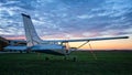 Small airplane parked on grass Royalty Free Stock Photo