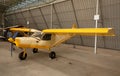 Small airplane with propeller in front parking in terminal. Royalty Free Stock Photo