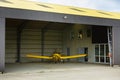 Small plane standing in shed Royalty Free Stock Photo