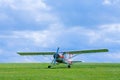 Small airplane before takeoff on the field Royalty Free Stock Photo
