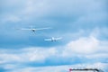 Small airplane helping a sailplane into sky Royalty Free Stock Photo