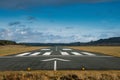 Small airport runway, blue cloudy sky. Royalty Free Stock Photo