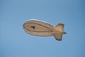 Small airship flying in blue sky Royalty Free Stock Photo