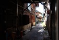 A small alley full of ancient wooden houses in Ban Na Kluea community