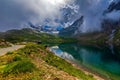 Small alpine lake on green shores in Piedmont, Italy.