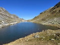 A small alpine lake Lai Nair (Black Lake or Schwarzer See) on the mountain road pass Fluela (FlÃ¼elapass)