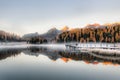 Small alpine lake lake with dawn fog Royalty Free Stock Photo