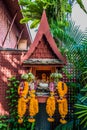 Small altar flower offerings Jim Thompson house Bangkok Thailand