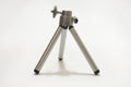 Small aluminimum camera tripod in close view Royalty Free Stock Photo