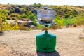 Small aluminum pan on a propane gas cylinder with burner for cooking outdoor. Equipment for cooking in the open air