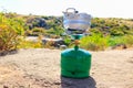 Small aluminum pan on propane gas cylinder with burner for cooking outdoor. Equipment for cooking in the open air