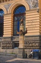 A small ancient column - decorates the facade of the building. Piazza Giovanni Bovio. Naples. Italy